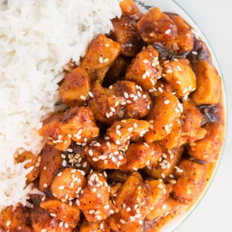 Easy One Pot Honey Sriracha Chicken on White Dish With Rice.
