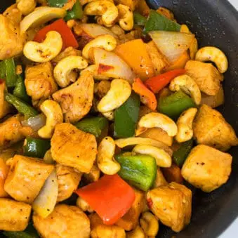 Easy One Pot Cashew Chicken on Marble Background- Overhead Shot.