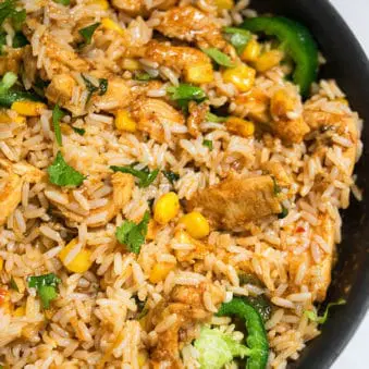 One Pot Chicken and Rice on Marble Background- Overhead Shot.