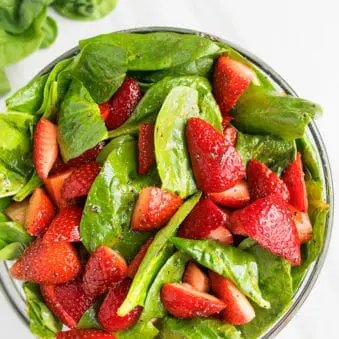 Easy Strawberry Spinach Salad With Poppy Seed Dressing on White Background.