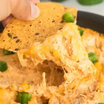 Easy One Pot Buffalo Chicken Dip on a Tortilla Chip.