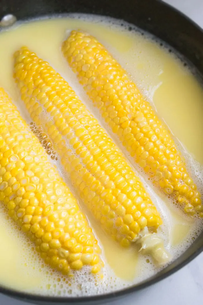 One Pot Boiled Corn on the Cob in Milk and Butter- Overhead Shot.