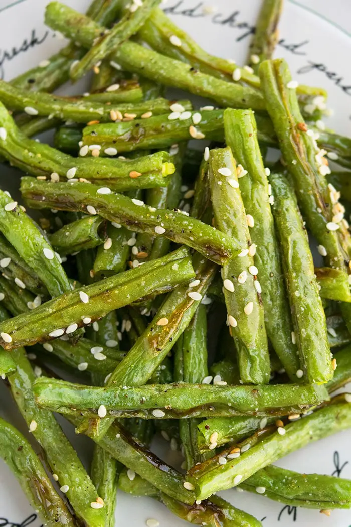 Easy Crispy One Pan Oven Roasted Green Beans on White Dish.