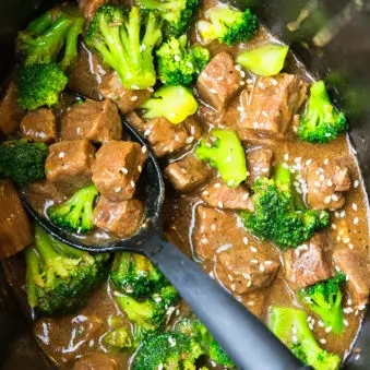 Easy Slow Cooker Beef and Broccoli With Black Spoon.