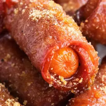 Easy Crispy One Pan Bacon Wrapped Smokies with Brown Sugar in White Dish- Closeup Shot.