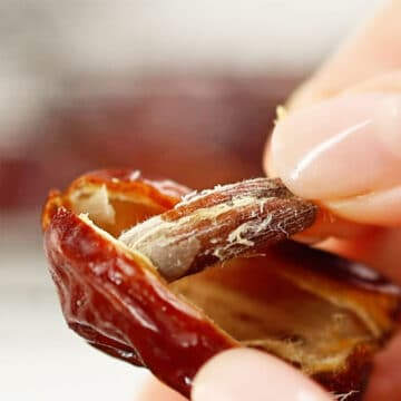 Pit being removed from a date.