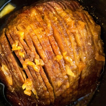 Easy Slow Cooker Ham with Pineapples and Brown Sugar in Black Crockpot- Overhead Shot.
