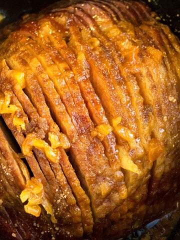 Easy Slow Cooker Ham with Pineapples and Brown Sugar in Black Crockpot- Overhead Shot.