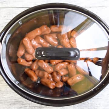 Crockpot with lid during cooking process. 