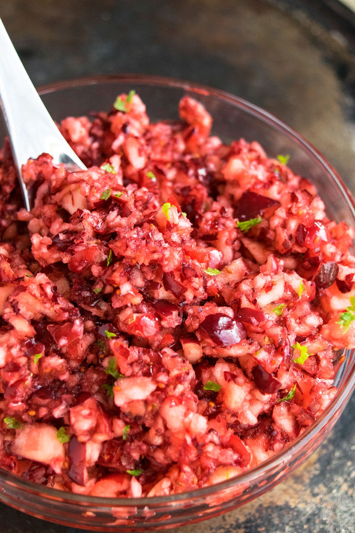 Bowl of Cranberry Side Dish With Stainless Steel Spoon. 