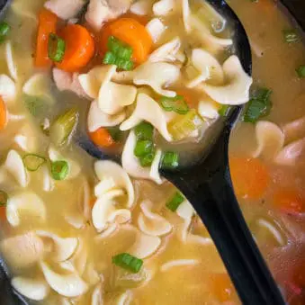 Ladle Full of Easy Crockpot Chicken Noodle Soup.