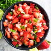 Best easy fresh strawberry salsa in black bowl- Overhead shot.