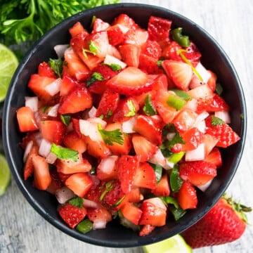 Best easy fresh strawberry salsa in black bowl- Overhead shot.