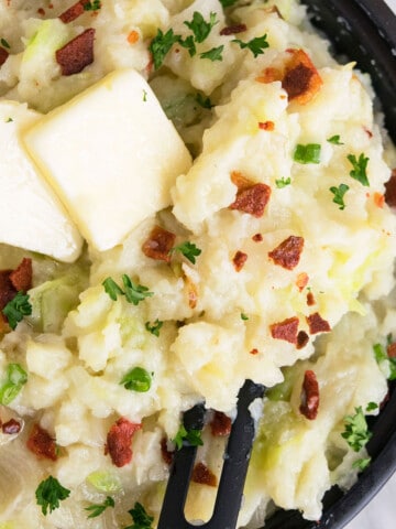 Easy one pot colcannon (Irish mashed potatoes with cabbage) in black nonstick pan- Overhead shot.