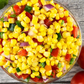 Best easy homemade corn salsa in glass bowl on rustic gray background.
