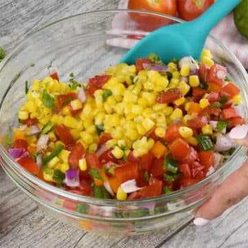 Ingredients being mixed together with a big spoon. 