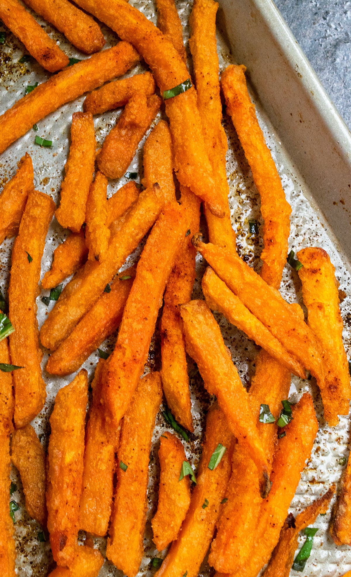 Crispy oven baked sweet potato fries in sheet pan. 
