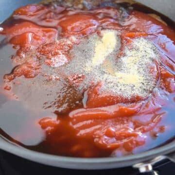 Sauce ingredients added to nonstick pan. 