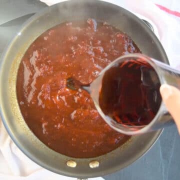 Soda pop being added to mixture. 