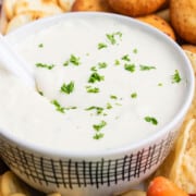 Best easy creamy homemade veggie dip in white bowl with a white spoon.