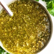 Easy homemade lender basil pesto sauce in bowl-Overhead shot.