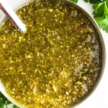 Easy homemade lender basil pesto sauce in bowl-Overhead shot.