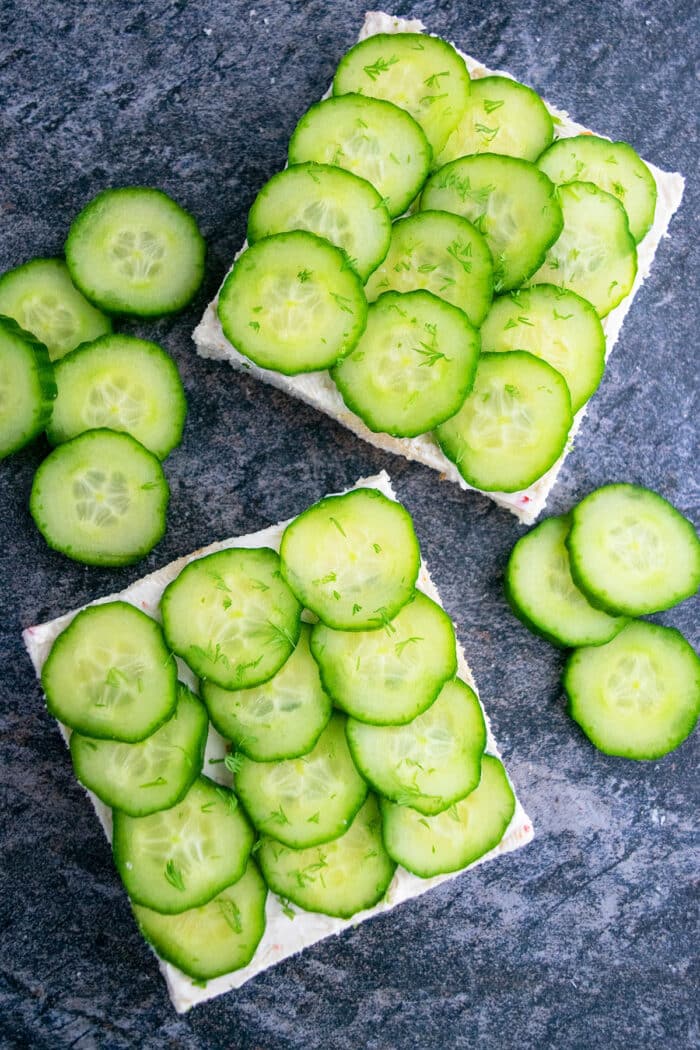 Open Faced Finger Sandwiches on gray background. 