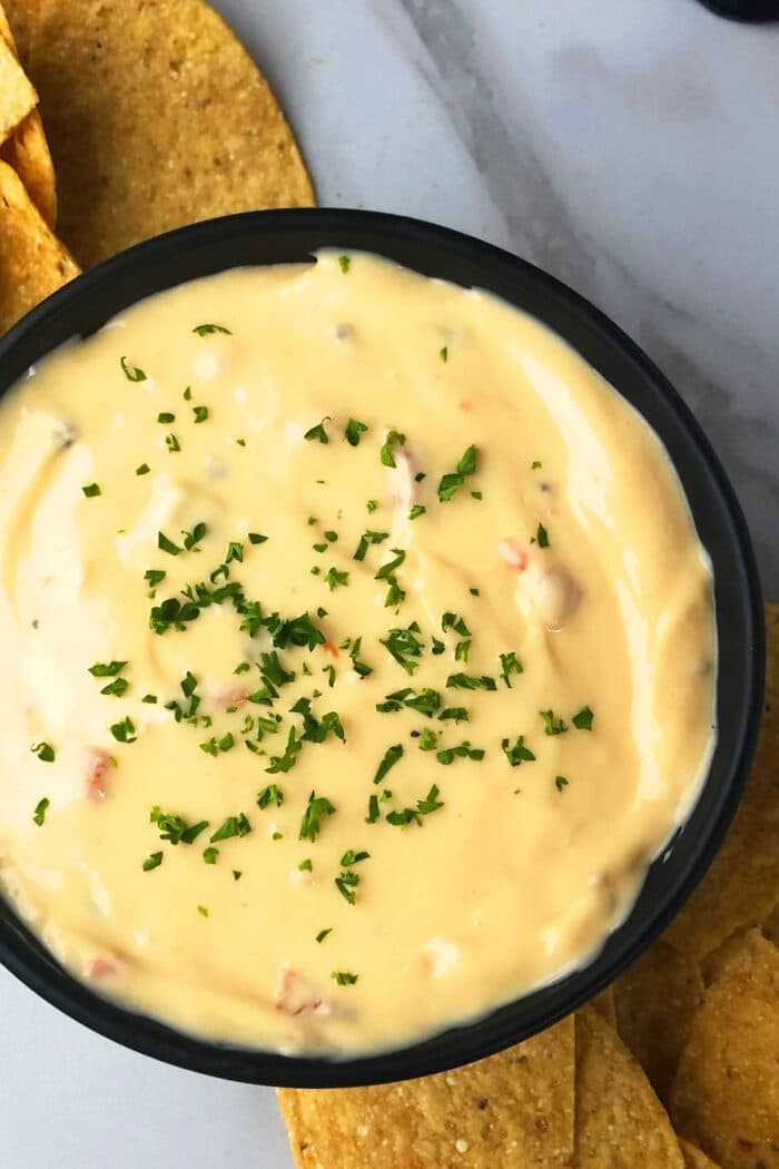 Black bowl of Mexican cheese dip- Overhead shot.  