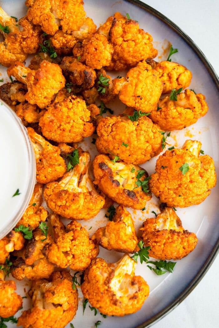 Oven Baked Buffalo Cauliflower Wings Recipe on White Plate- Overhead Shot. 