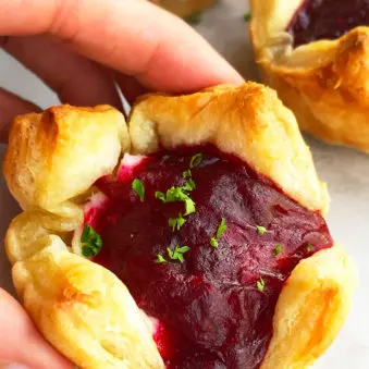 Easy Mini Cranberry Brie Bites- Holding Shot