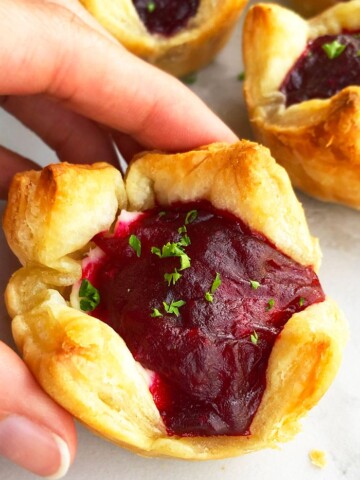 Easy Mini Cranberry Brie Bites- Holding Shot