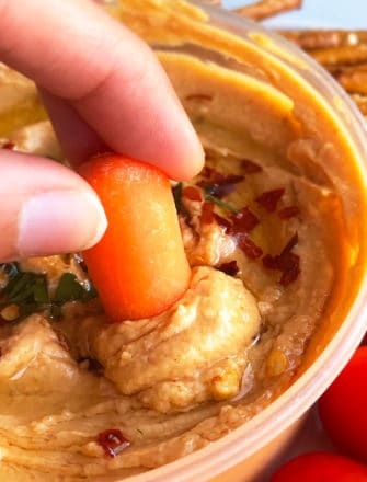 Bowl of Roasted Red Pepper Hummus For Dipping Carrots