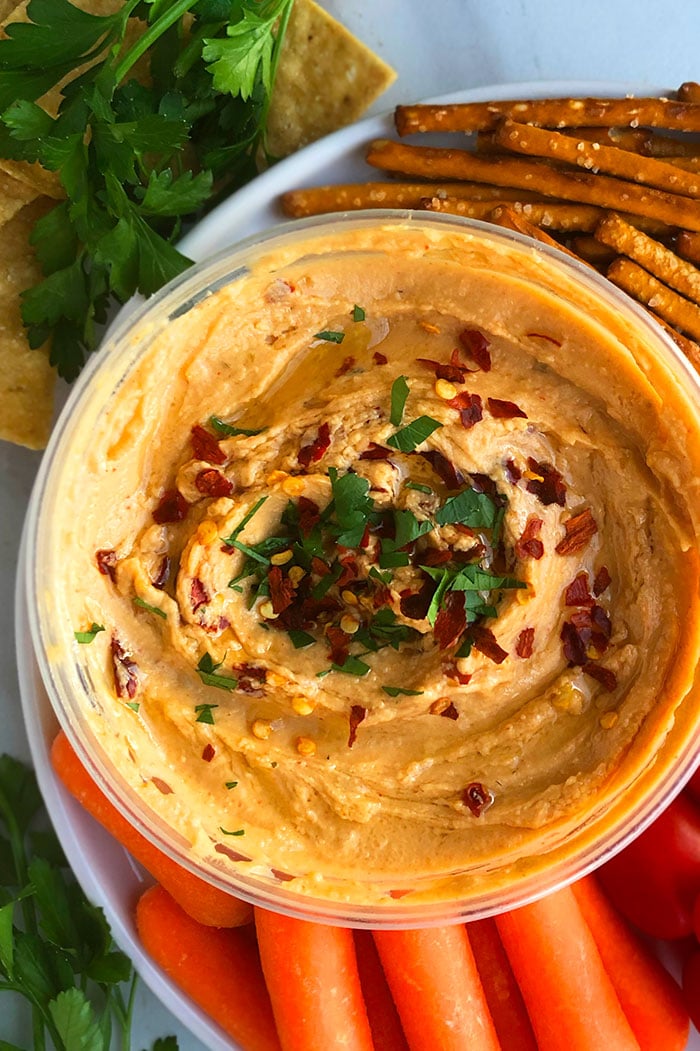 Homemade Roasted Red Pepper Hummus Dip on a Plate of Veggies