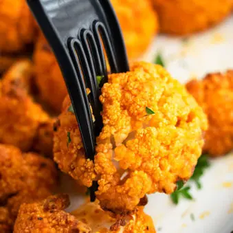 Easy Oven Baked Buffalo Cauliflower Wings on Fork