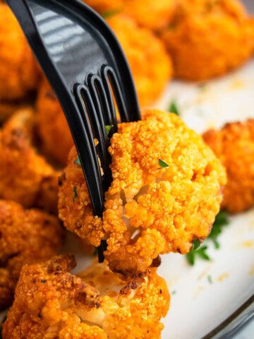 Easy Oven Baked Buffalo Cauliflower Wings on Fork