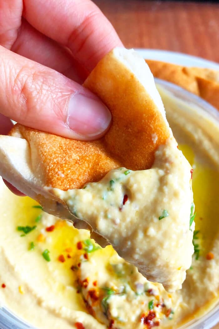 Pita Bread Slice loaded with Mediterranean dip- Closeup Shot.