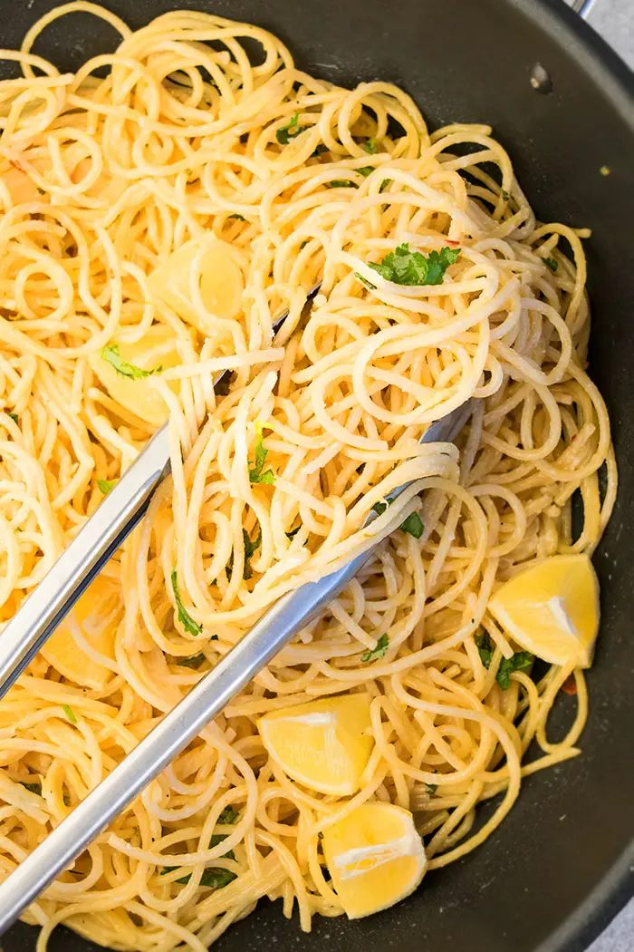 Creamy Lemon Garlic Pasta in Black Pot With Tongs