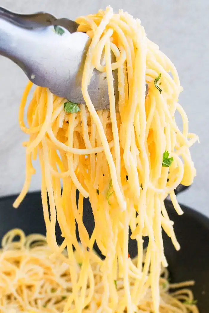 Easy Lemon Pasta Scooped in Tongs 