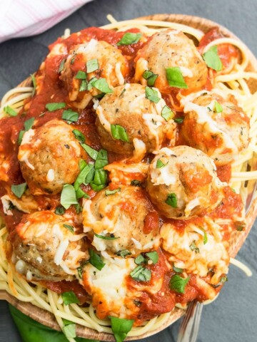 Plate of Easy Meatball Casserole with Basil Garnish