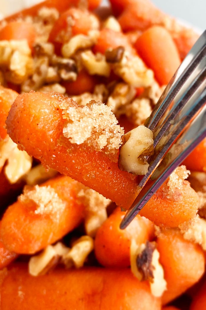 Closeup of Fork with Honey Candied Carrots and Nuts