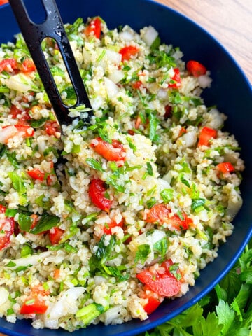 Spoonful of Easy Homemade Tabbouleh Salad in Blue Bowl