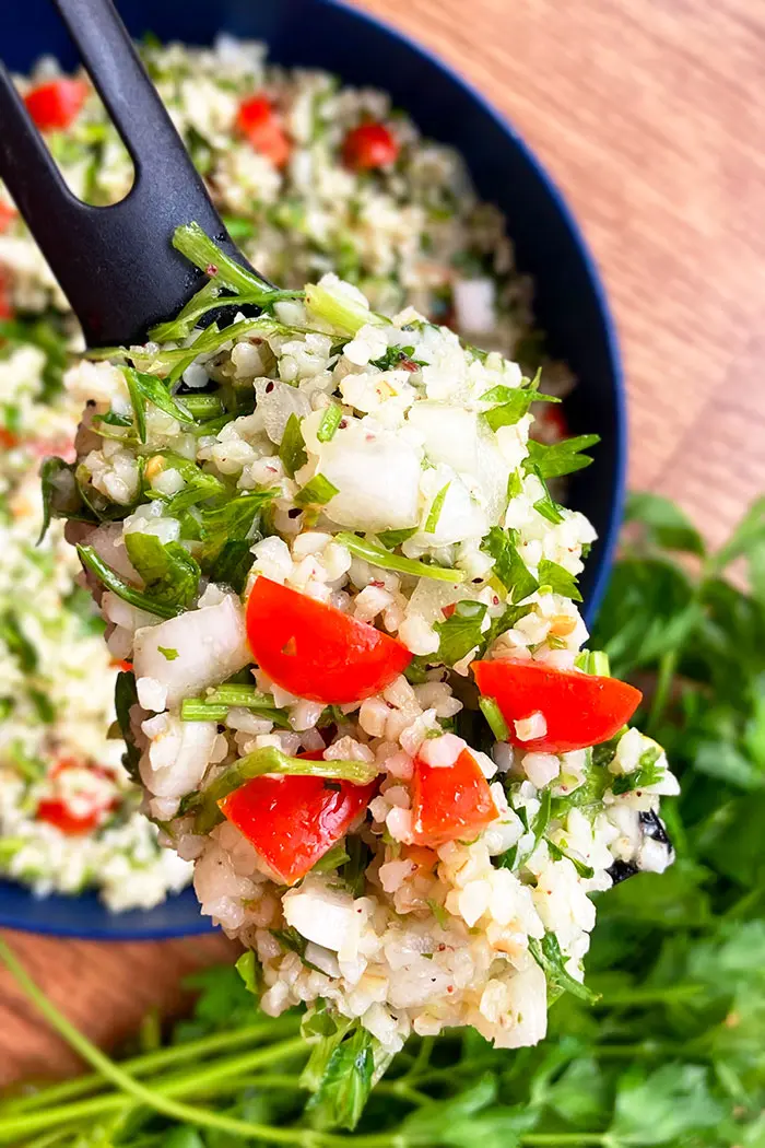 Closeup Shot of Spoonful of Tabouli Salad 