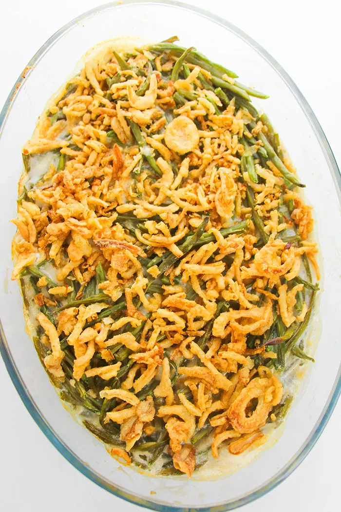 Overhead Shot of Homemade Green Bean Casserole With Crispy Fried Onions in Glass Dish