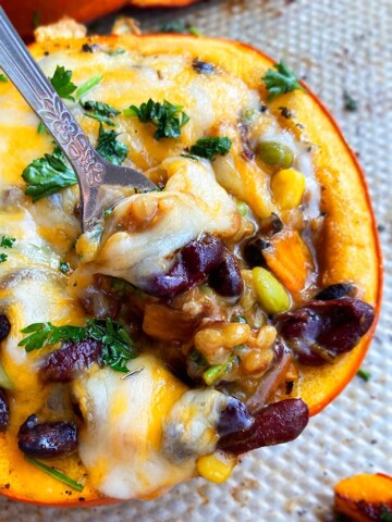 Easy Homemade Roasted Stuffed Pumpkin- Closeup Shot With a Spoonful of Filling