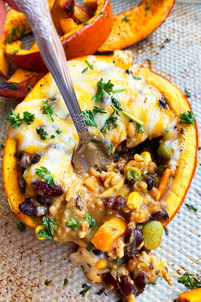 Easy Mini Stuffed Pumpkin with Meat, Vegetables, Beans and Cheese with Partial Scoop on Silver Baking Tray