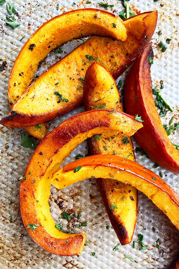 Overhead Shot of Homemade Roasted Pumpkin Wedges in Silver Baking Tray