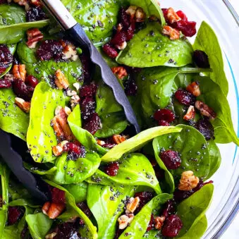 Easy Homemade Christmas Salad in Glass Bowl on White Background