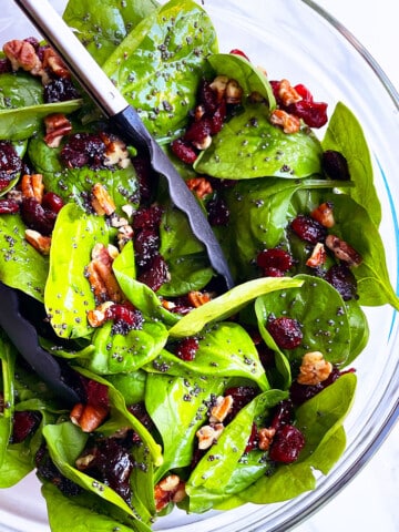 Easy Homemade Christmas Salad in Glass Bowl on White Background