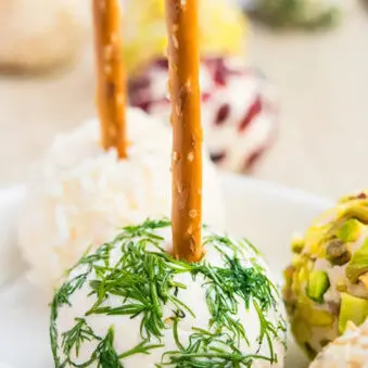 Easy Mini Cream Cheese Balls on White Plate With Various Toppings