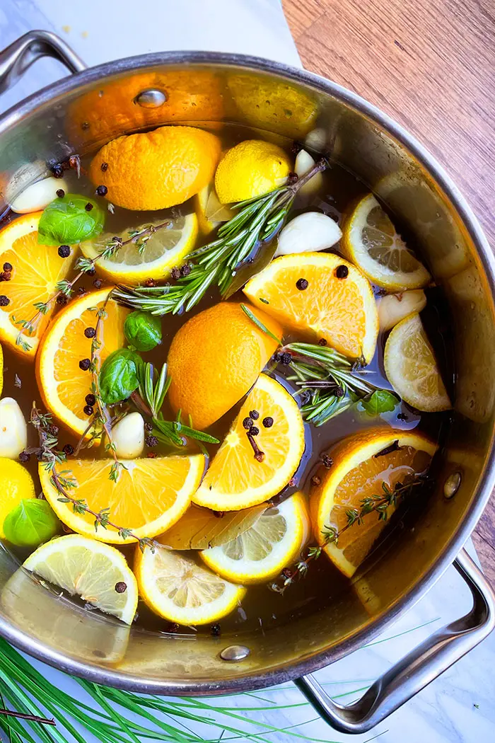 Citrus Brine in Silver Pot on White Background